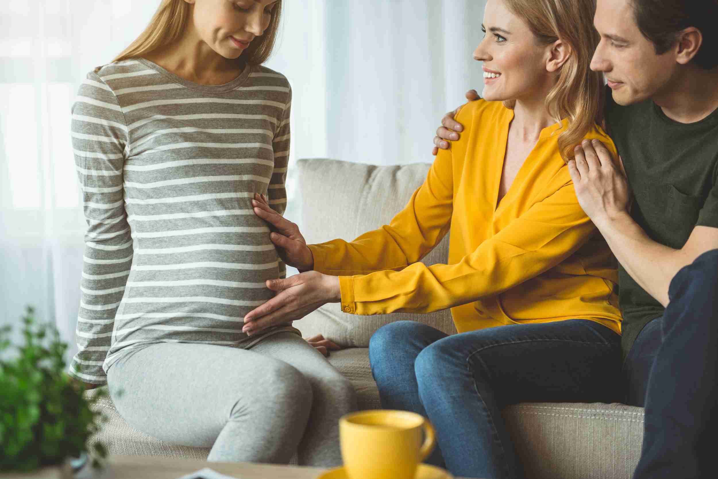 A surrogate sitting with intended parents