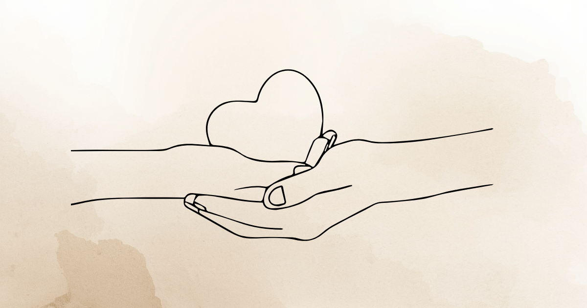 Two hands holding a heart